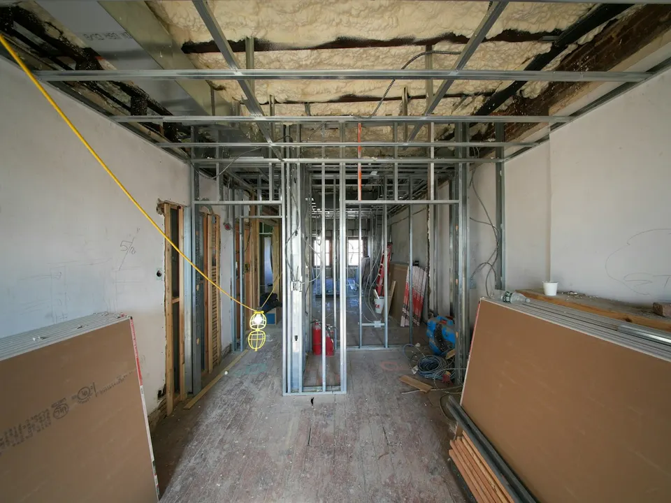 Framed Grey Bruce interior with drywall staged for scope review